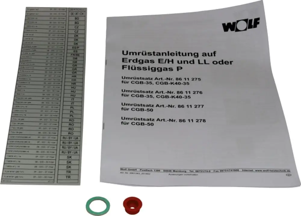 Umrüstsatz von Wolf mit Dokumentation für die Umrüstung auf Erdgas E/LL und Flüssiggas, einschließlich Adapter und Dichtungen, abgebildet neben einer Übersichtstabelle.